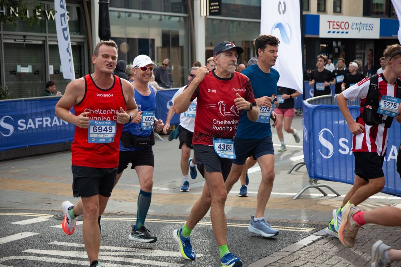 Greg with fellow club runners at a race event